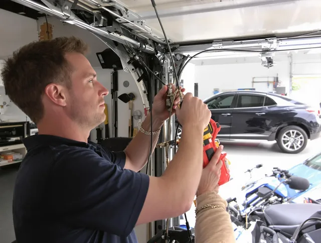 Indian Trail Garage Door Repair safety certified technician performing cable replacement in Indian Trail