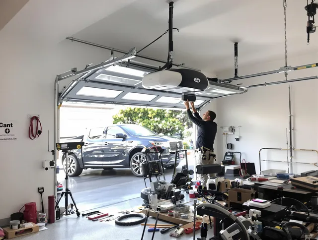 Indian Trail Garage Door Repair specialist installing smart garage door opener system in Indian Trail home